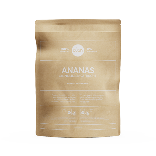 Ananas Refiller von buah in einer braunen Papierverpackung vor gelbem Hintergrund