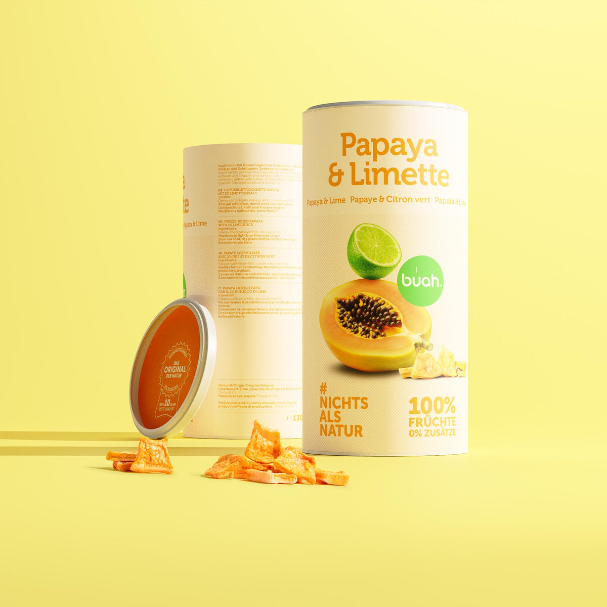Aufrecht stehende buah-Dosen „Papaya & Limette“ Vorder- und Rückseite mit gefriergetrockneter Papaya und 2 % Limettensaft; sichtbar: „Nichts als Natur“.