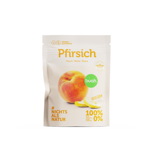 buah Snackpack Pfirsich mit einem kleinen Haufen gefriergetrockneter Pfirsiche im Vordergrund
