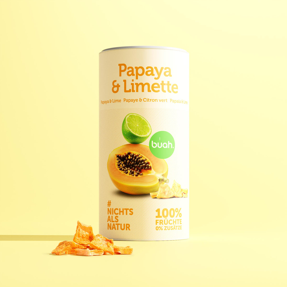 Quadratische Produktdarstellung einer buah-Dose „Papaya & Limette“ mit gefriergetrockneter Papaya auf hellgelbem Hintergrund; „100 % Früchte, 0 % Zusätze“.